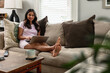 © Gerald Carter/Creative Flame - Indian American woman works from home remotely on laptop, telework