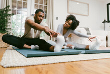 Black Couple Stretches And Workout At Home Together