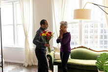 Senior Man Surprises Wife With Flowers, Celebrating Valentines Day