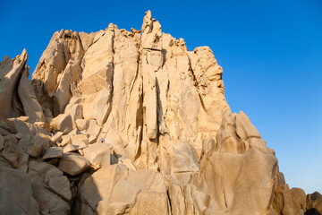 Sticker - Cabo San Lucas, Baja California Sur, Mexico - Low angle view of a large, natural rock formation on the beach.