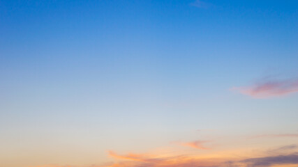 Wall Mural - beautiful sky painted by the sun leaving bright golden shades.dense clouds in twilight sky in winter