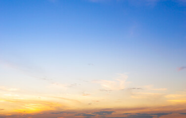 Wall Mural - beautiful sky painted by the sun leaving bright golden shades.dense clouds in twilight sky in winter