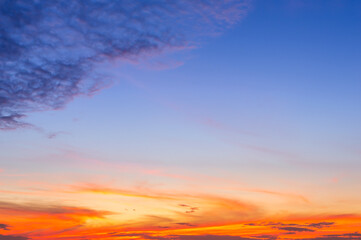 Wall Mural - beautiful sky painted by the sun leaving bright golden shades.dense clouds in twilight sky in winter