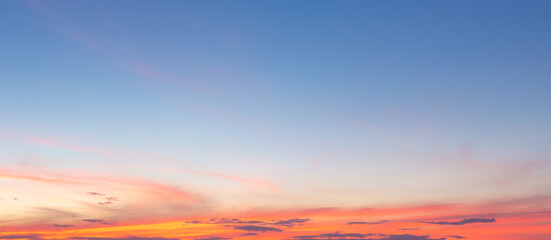 Wall Mural - beautiful sky painted by the sun leaving bright golden shades.dense clouds in twilight sky in winter