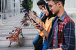 Millennial generation people using smartphones. Young people addicted from social network application dependency concept.