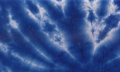 Wall Mural - blue sky with clouds tie dye fabric cloth background design textured. weather storm cloudscape dark rain light wallpaper.
