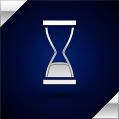 Silver Old hourglass with flowing sand icon isolated on dark blue background. Sand clock sign. Business and time management concept. Vector.