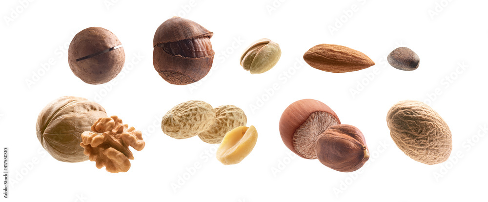 Large collection of different nuts on a white background - obrazy, fototapety, plakaty 