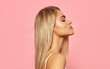 © kiuikson - Portrait of profile face of sexy blonde woman on pink background