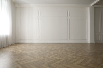 parquet floor in light spacious empty room