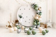 Birthday Decorations - Gifts, Toys, Balloons, Garland And Number For Little Baby Party On A White Wall Background.
