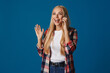 © Drobot Dean - Excited blonde girl gesturing while talking on smartphone