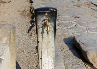 Wall Mural - Water pump on a street of Pompeii.