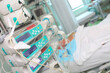 Intensive care unit with unconscious patient and advanced equipment