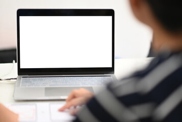 Cropped shot of Programmer using mockup blank screen laptop.