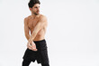 © Drobot Dean - Half-naked athletic sportsman doing exercise while working out