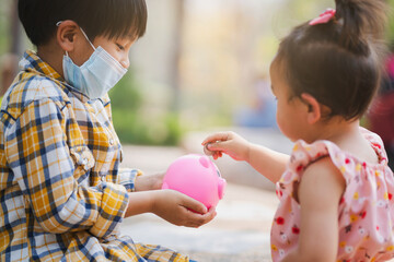 Poster - Little girl coin operated Into a piggy bank for saving money