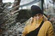 © RooM The Agency - Portrait of a young woman in a puffer jacket standing by a Christmas tree, France