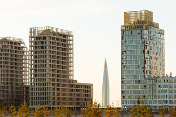 Alluvium of Vasileostrovsky island, Morskaya embankment, Skyscraper lakhta center between two residential buildings. Construction. Lahta in St. Petersburg.