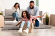 © Prostock-studio - Happy African American family celebrating moving day in new apartment