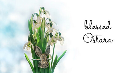 Canvas Print - Blessed Ostara greeting card. snowdrops and metallic decorative rabbit, symbol Ostara or Easter holiday. festive spring season. wicca pagan tradition