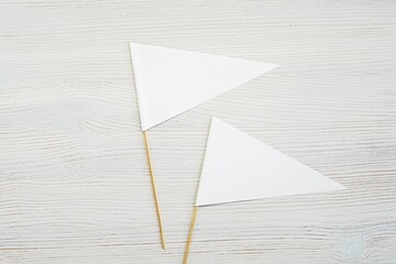 Triangle pennant flag mockup, two small blank paper flags template for design presentation.