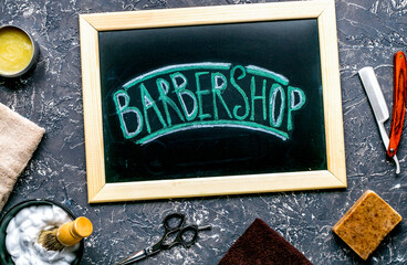 Wall Mural - male hairdressing concept with barbershop tools on gray background top view