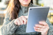 © Marcela Ruty Romero - Close up of female hand using a tablet.