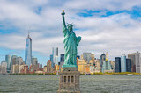 Fototapeta Nowy Jork - Statue of Liberty wide angle image with Manhattan skyline taken from the ferry, maintenance works in progress