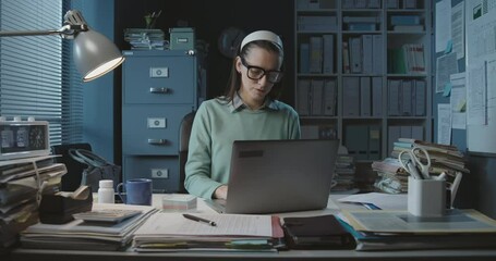 Wall Mural - Professional secretary sitting at desk and working