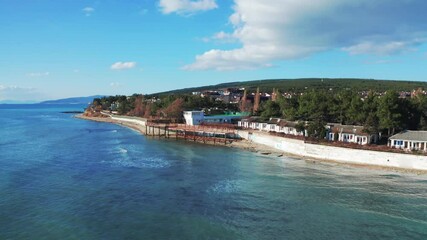 Wall Mural - Aerial view at sea coastline with buildings near ocean water, beautiful azure water, summer travel concept.