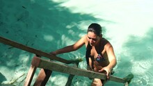 woman in bikini nature pool
