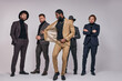 © Roman - mixed race group of young handsome men models in stylish formal wear going at party. isolated studio portrait
