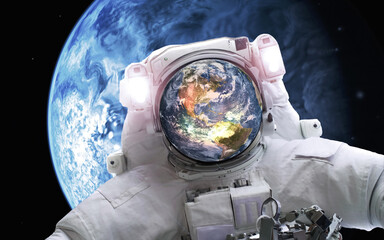 Wall Mural - space astronaut with earth planet in the helmet in outer space. elements of this image were furnishe