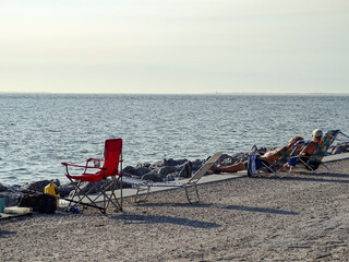 Sun bathing by the ocean