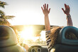 © simona - Happy lifestyle women couple enjoy travel with convertible car dancing and driving in the sunset - concept of joyful leisure transport trip activity for friends people having fun together - summer