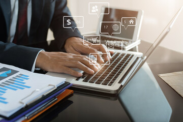 Social media and Marketing virtual icons screen of business women typing keyboard with laptop computer and tablet at office.