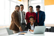 © Alexandr - team of young african people in the office at the table with a laptop