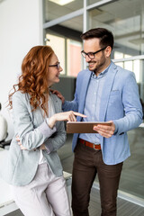 Business people having fun and chatting at workplace office