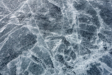  The surface texture of the ice. A cracked ice floe. Winter cold background