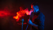 © alexkoral - man is smoking a hookah in bar and blowing a cloud of smoke
