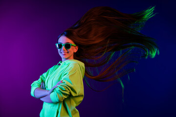 Sticker - Photo of confident happy young woman fly hair hold hands crossed isolated on gradient colorful background