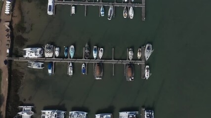 Wall Mural - Aerial birds eye footage of Yachts and Boats moored at Thornham Marina near Emsworth in Southern England.