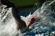 Swimming crawl sportsman with splashes