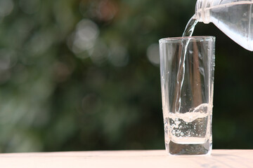 Poster - water pouring into glass