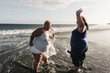 © DisobeyArt - Curvy women dancing on the beach having fun during summer vacation - Main focus on left woman face