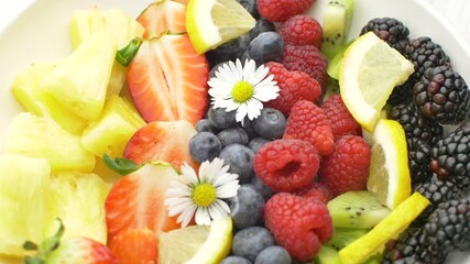 Wall Mural - delicious fruit salad with fresh strawberry,kiwi,blackberry,pineapple and raspberry