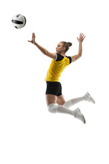 Flying. Young female volleyball player isolated on white studio background. Woman in sportswear training and practicing in action, flight. Concept of sport, healthy lifestyle, motion and movement.