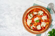 © fotofabrika - Top view of pizza Margherita on gray surface