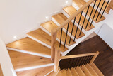 Fototapeta Uliczki - Wood staircase inside contemporary white modern house.
